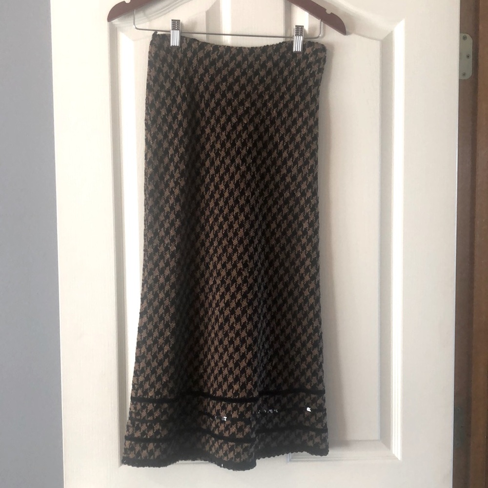Long wool skirt with velvet and sequin accents.